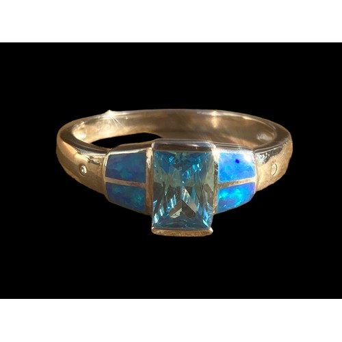 491 - A QUALITY TOPAZ AND OPAL STYLE SILVER RING