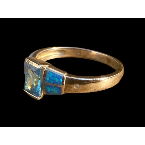 491 - A QUALITY TOPAZ AND OPAL STYLE SILVER RING