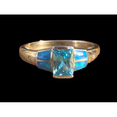 491 - A QUALITY TOPAZ AND OPAL STYLE SILVER RING