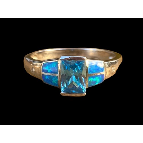 491 - A QUALITY TOPAZ AND OPAL STYLE SILVER RING