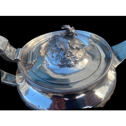 556 - AN ORNATE IRISH GEORGIAN (1810) SILVER TEAPOT  700grm