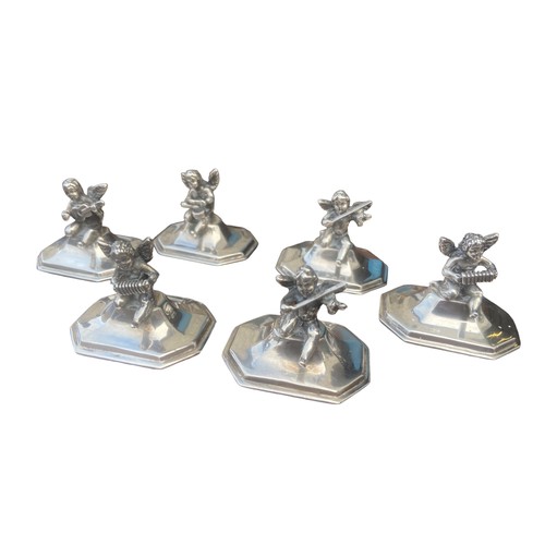 564 - A RARE SET OF 6 CAST SILVER MENU/PLACE NAME HOLDERS MODELLED AS A GROUP OF MINGED PUTI PLAYING VARIO... 