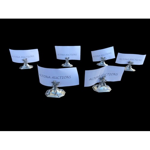 564 - A RARE SET OF 6 CAST SILVER MENU/PLACE NAME HOLDERS MODELLED AS A GROUP OF MINGED PUTI PLAYING VARIO... 