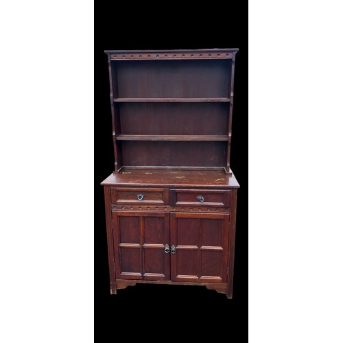 14 - A NEAT SIZE DARK OAK DRESSER WITH PANEL DOORS