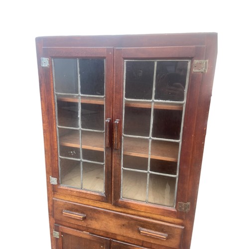 23 - A VINTAGE KITCHEN CABIBET WITH LEADED GLASS DOORS