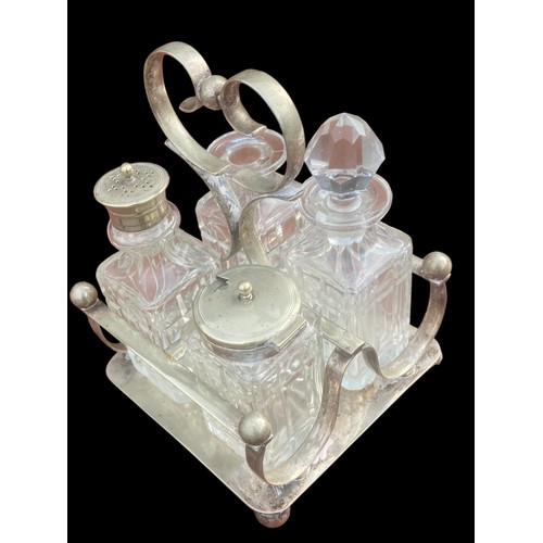 43 - AN ANTIQUE CUT GLASS CRUET SET