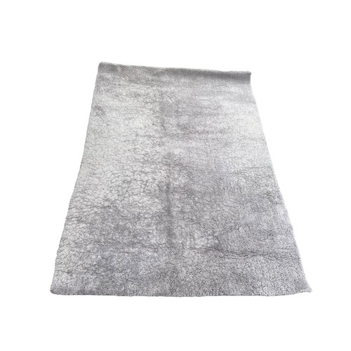 21 - A LARGE  GREY RUG