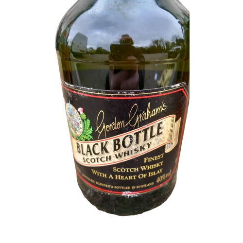 64 - A 1.5lit BOTTLE OF GORDON GRAHAMS BLACK BOTTLE SCOTCH WHISKY