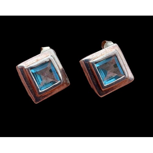 154 - A PAIR OF SILVER AND BLUE TOPAZ EARRINGS