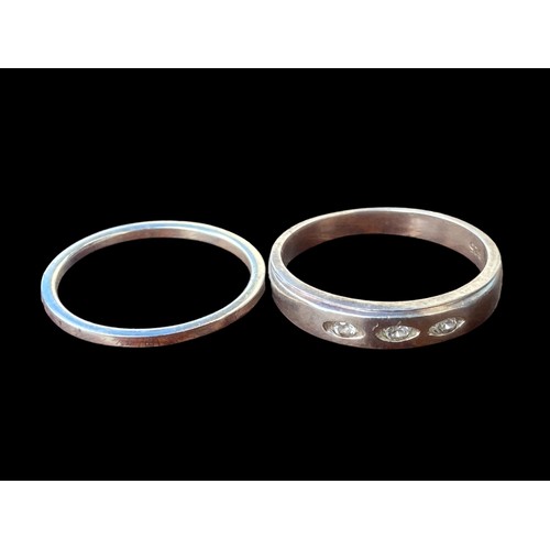 196 - 2 SILVER RINGS- CLEAR BAND & ONE SET WITH 3 STONES