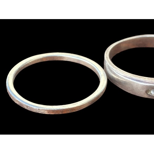 196 - 2 SILVER RINGS- CLEAR BAND & ONE SET WITH 3 STONES