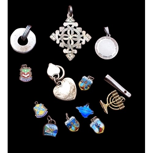 226 - MIXED SILVER PENDANTS AND AN ASSORTMENT OF SILVER OF SILVER AND ENAMEL CHARMS