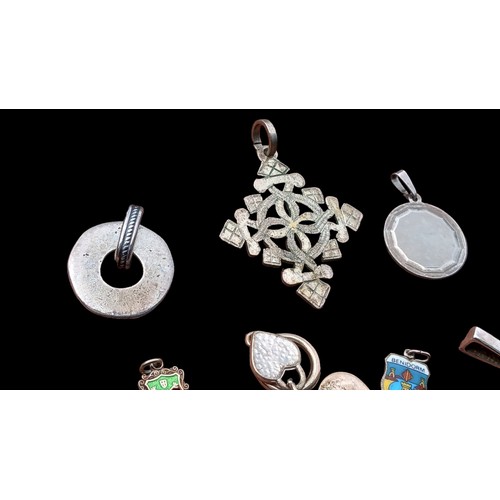 226 - MIXED SILVER PENDANTS AND AN ASSORTMENT OF SILVER OF SILVER AND ENAMEL CHARMS