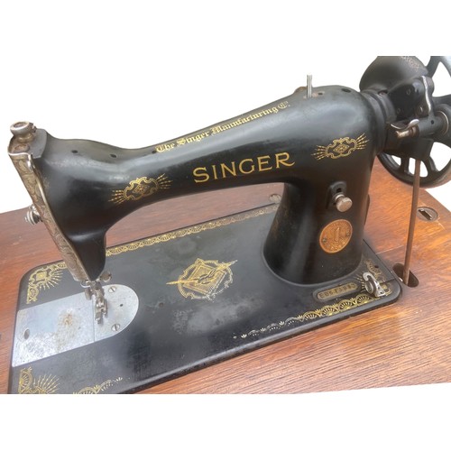 A FULLY RESTORED ORIGINAL SINGER SEWING MACHINE ON AN ORIGINAL OAK BASE ...