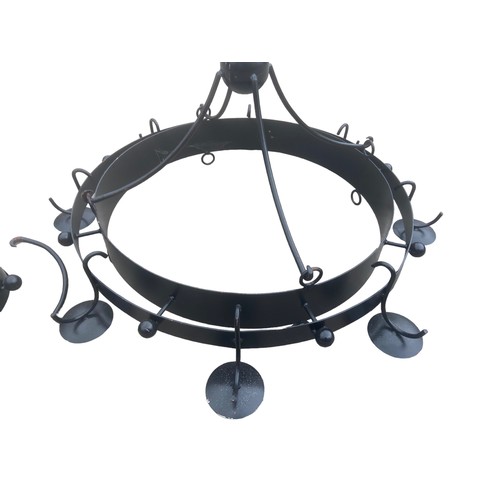 67 - A LARGE BLACK METAL CIRCULAR CHANDALIER STYLE CANDLELABRA