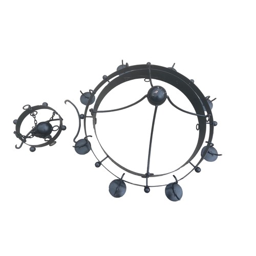 67 - A LARGE BLACK METAL CIRCULAR CHANDALIER STYLE CANDLELABRA