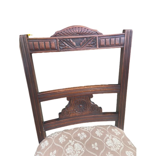 115A - A MAHOGANY NURSING CHAIR