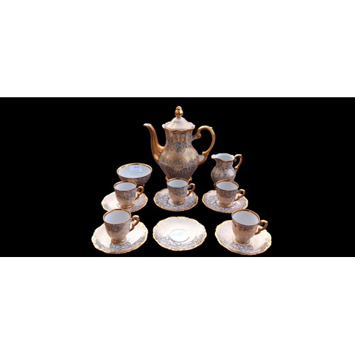 101B - A GILT AND WHITE  TEA SERVICE