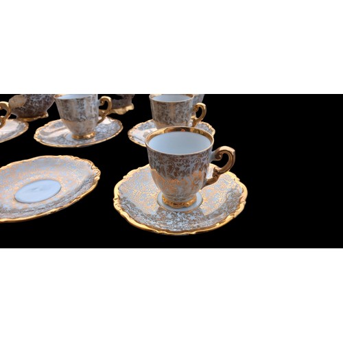 101B - A GILT AND WHITE  TEA SERVICE