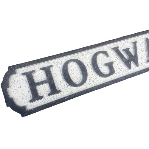 117 - A WOODEN HOGWARTS SIGN 30.5X5.5