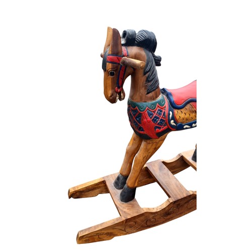 127 - SOLID CARVED WOODEN ROCKING HORSE