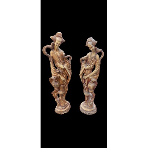 158 - A PAIR OF RESIN JAPANESE LADIES SATND 18