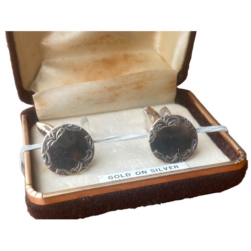 180 - A PAIR OF GOLD ON SILVER CUFFLINKS