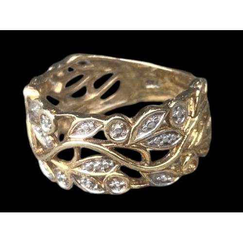 195 - A SILVER GILT GEM SET OPENWORK RING WITH FOLIAGE DESIGN