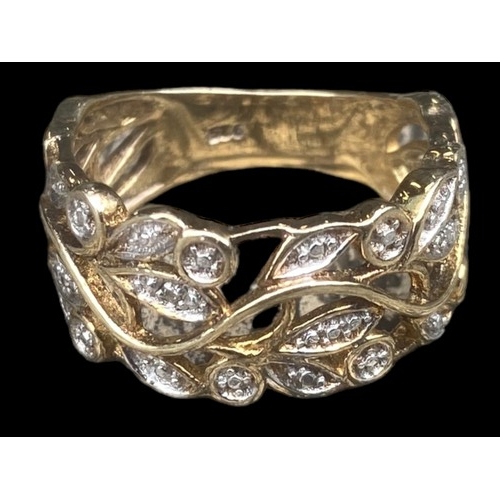 195 - A SILVER GILT GEM SET OPENWORK RING WITH FOLIAGE DESIGN