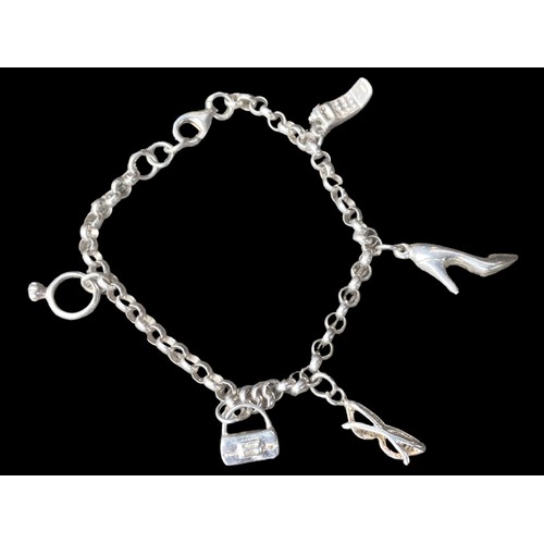 203 - A SILVER CHARM BRACELET WITH CHARMS