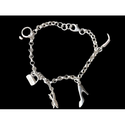 203 - A SILVER CHARM BRACELET WITH CHARMS