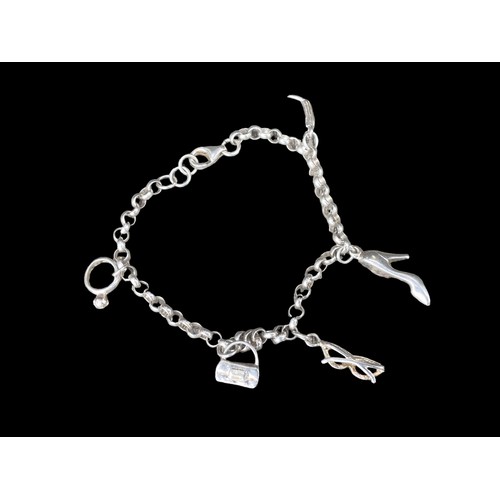 203 - A SILVER CHARM BRACELET WITH CHARMS