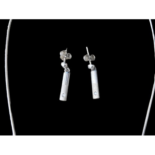 209 - A MATCHING HOT DIAMOND SILVER NECKLACE AND EARRING SET