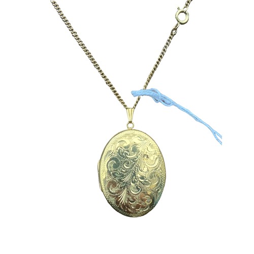 222 - A ROLLED GOLD OVAL LOCKET ON A ROLLED GOLD CHAIN