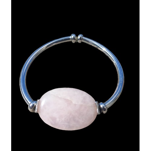 246 - A BOXED ROSE QUARTZ BANGLE