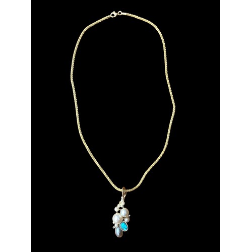 247 - AN USUAL SILVER GOLD PLATED PENDANT & CHAIN