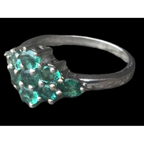 258 - A SILVER BEAUTIFUL SILVER RING SET WITH GREEN STONES