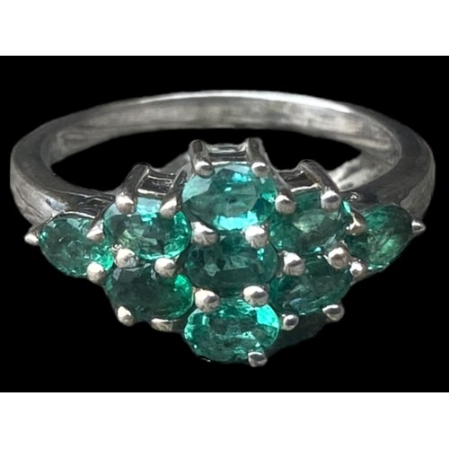 258 - A SILVER BEAUTIFUL SILVER RING SET WITH GREEN STONES