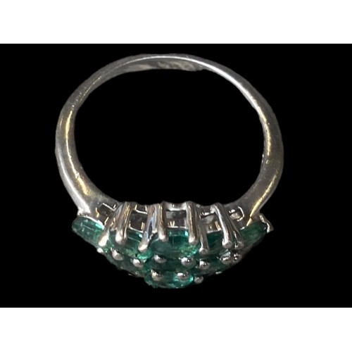 258 - A SILVER BEAUTIFUL SILVER RING SET WITH GREEN STONES