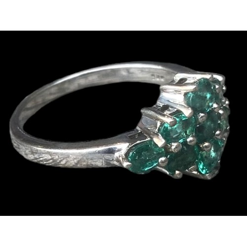 258 - A SILVER BEAUTIFUL SILVER RING SET WITH GREEN STONES