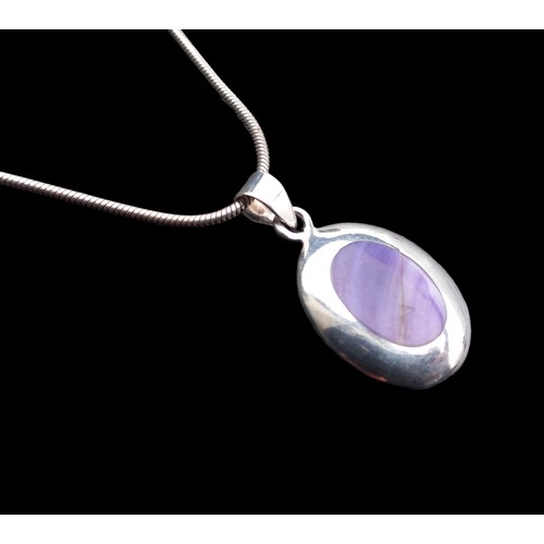 260 - SILVER AND PURPLE STONE PENDANT ON A SILVER CHAIN