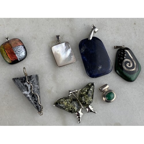 283 - SELECTION OF SILVER MOUNTED PENDANTS