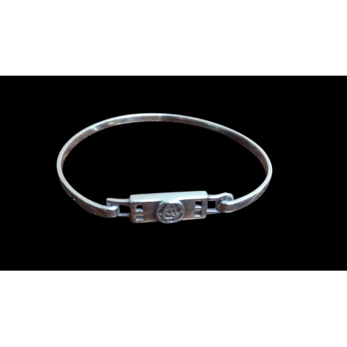 214 - A SILVER RENNIE MACINTOSH STYLE BANGLE