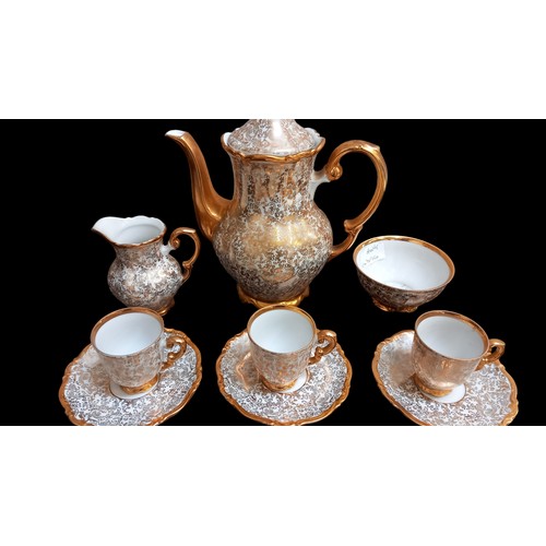 313 - A 14 PIECE GILT AND WHITE COFFEE SERVICE