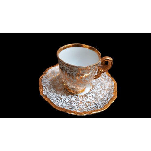 313 - A 14 PIECE GILT AND WHITE COFFEE SERVICE