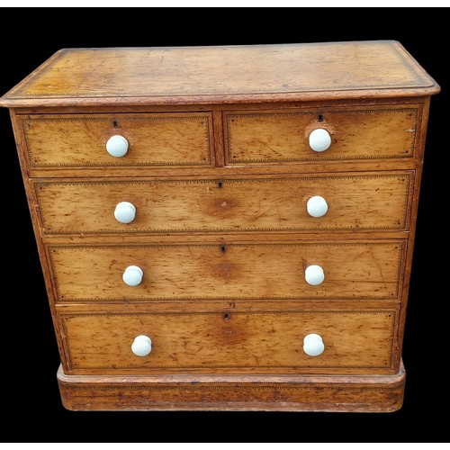 388 - A BEAUTIFUL ANTIQUE PINE CHEST WITH WHITE PORCELIAN HANDLES WITH A BEAUTFUL POKERWORK TRIM 42