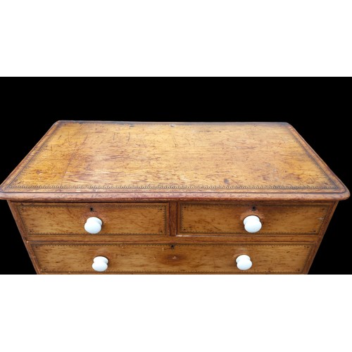 388 - A BEAUTIFUL ANTIQUE PINE CHEST WITH WHITE PORCELIAN HANDLES WITH A BEAUTFUL POKERWORK TRIM 42