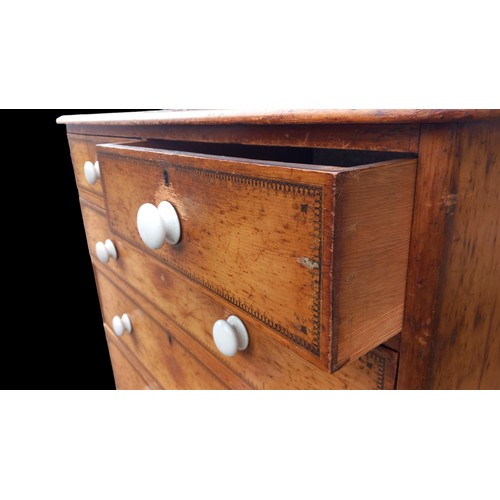 388 - A BEAUTIFUL ANTIQUE PINE CHEST WITH WHITE PORCELIAN HANDLES WITH A BEAUTFUL POKERWORK TRIM 42