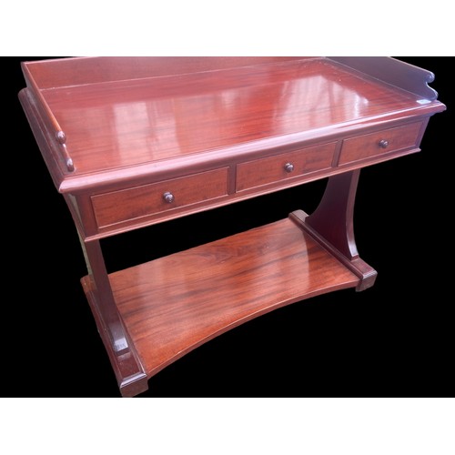 394 - A FLAME MAHOGANY 3 DRAWER GALLERY BACK LIBARY TABLE 42x22x33