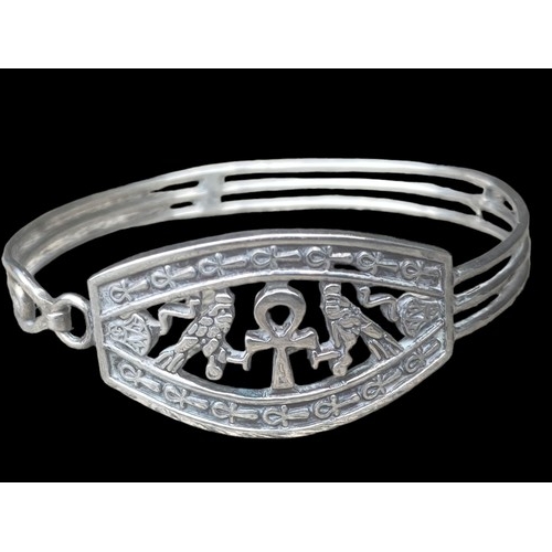 412 - A HEAVY EGYPTIAN THEMED SILVER BRACELET